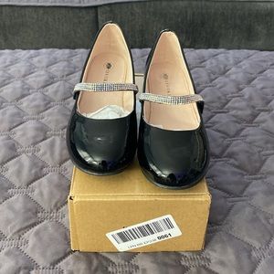 Girls Black Patent Leather Mary Jane Dress Shows With Low Heel.